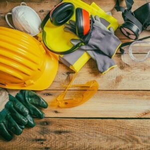 Safety equipment laying on wooden floor.