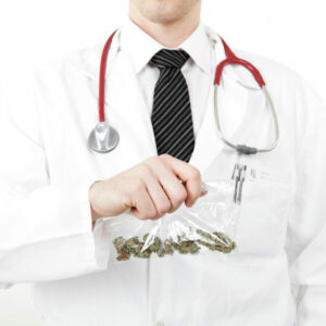 Medical doctor wearing white coat holding a bag that contains marijuana.